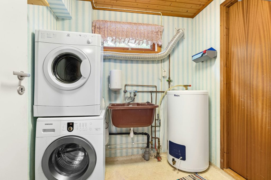 A washer and dryer in a small room