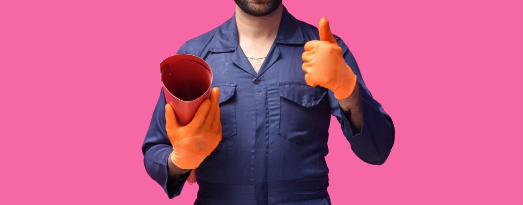 a person wearing a hard hat and holding a ball