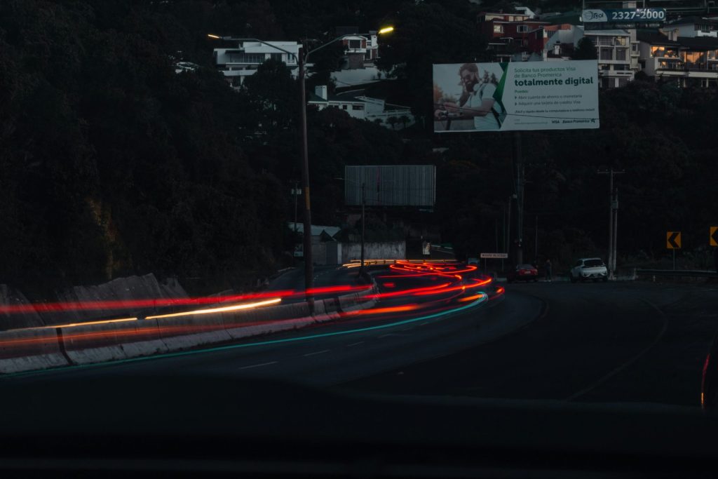 a blurry photo of a city street at night